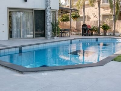 Modern Poolside Retreat with Tropical Touches