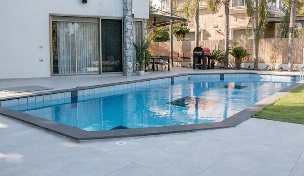 Modern Poolside Retreat with Tropical Touches