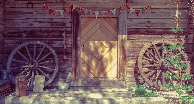 Frontier Cabin Porch with Wagon Wheels