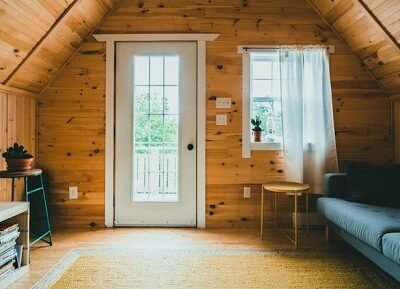 Asheville Cabin Interior has Vaulted Wood Ceiling with Natural light