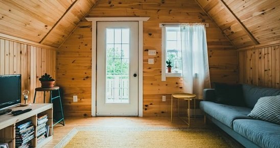 Asheville Cabin Interior has Vaulted Wood Ceiling with Natural light