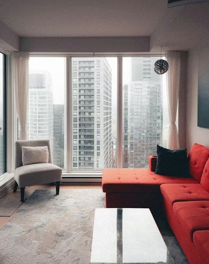 High-rise apartment, floor-to-ceiling windows, city views, filming, TikTok, YouTube